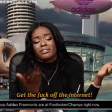 a woman says get the fuck off the internet in front of a pink adidas balloon