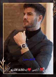 a man with a beard wearing a watch and a black suit