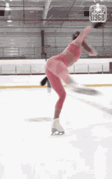 a woman in a pink top and pants is ice skating