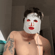 a shirtless man is wearing a white mask that says toothwave on it