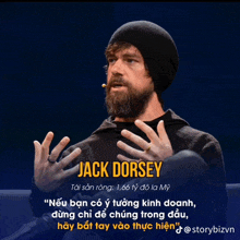 a man with a beard wearing a black beanie and a microphone is talking about jack dorsey