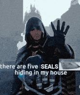 a man in a hooded jacket says there are five seals hiding in my house with a picture of a seal