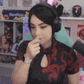 a woman wearing headphones and a renrize sign in the background