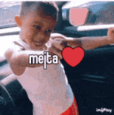 a young boy in a car with the word meita above his head