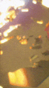 a blurry picture of a person 's face with a purple and yellow background