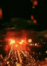 a blurred image of a volcano with a lot of fire