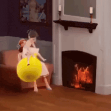 a doll is sitting in a chair holding a yellow ball
