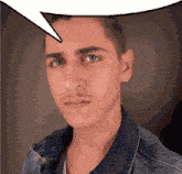 a man in a denim jacket has a speech bubble over his head