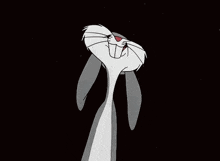 bugs bunny is a cartoon character from the looney tunes series and is sitting down with his hands folded .