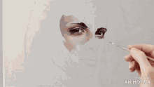 a painting of a woman 's face is being made in animatica