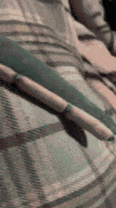 a person is laying on a bed with a bunch of sausages wrapped around their waist