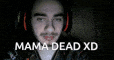 a man wearing headphones with mama dead xd written on the bottom