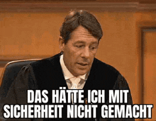 a man in a judge 's robe is sitting in a courtroom with a caption that says das hatte ich mit