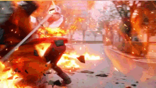 a car is on fire on the side of a street