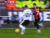 a soccer player with the number 7 on his jersey kicks the ball