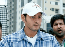 a man wearing a white cap that says director on it