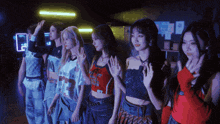 a group of girls are standing in a line wearing shirts with the number 97 on them