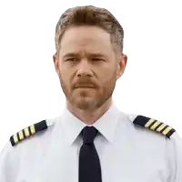 a man with a beard wears a white shirt and a tie