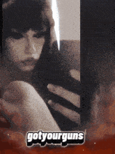 a black and white photo of a woman with the words got yourguns on the bottom