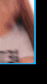 a blurry photo of a person 's face with a blue border