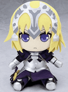 a stuffed toy of a girl with purple eyes and a horseshoe on her head