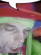 a close up of a person 's face with a speech bubble above them