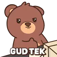 a brown teddy bear is sitting in front of a computer screen
