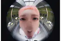 a man with pink hair is making a funny face