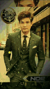a man in a suit and tie is standing on a street