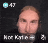a close up of a person 's face with the words not katie + on the bottom