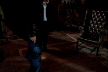 a man wearing a white shirt and a blue jacket