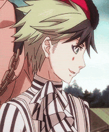 a close up of a person 's face with a striped shirt on