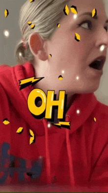 a woman wearing a red hoodie with the word oh above her head