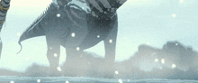 a dinosaur is standing in the snow with a blurred background
