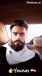 a man with a beard is sitting in the back seat of a car with pixverse.ai written below him