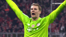 a soccer player with his arms in the air and the words fc bayern tv on the bottom right