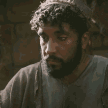 a man with a beard looks at a woman