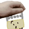 a hand is holding a yellow electrical outlet with a smiley face on it .