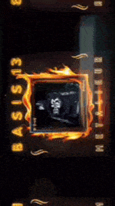 a close up of a clock with flames and numbers on it