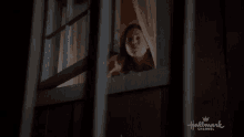 a hallmark channel advertisement with a window