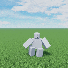 a white robot with a smile on his face is standing in the grass