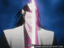 a gif of a man holding a pink light saber