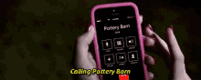a person is holding a cell phone that says calling pottery barn on the screen