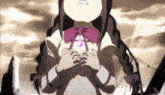 a little girl with braids and a pink bow tie is holding her hands together .
