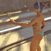 a woman in a bikini is wearing headphones and pointing at something
