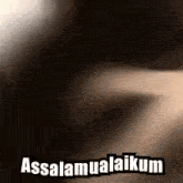 a close up of a person 's face with the words assalamualaikum on it