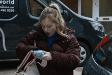 Summer Fumbling With Her Phone And Portable Charger Coronation Street GIF - Summer Fumbling With Her Phone And Portable Charger Coronation Street Corrie GIFs