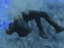 a man is falling through the air in a blue room .