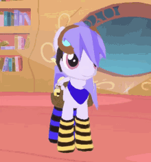 a cartoon pony with purple hair and striped socks stands in front of a bookshelf