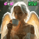 a woman with angel wings is drinking from a cup with the word soon on her chest